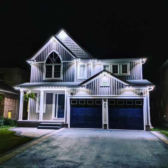 Front view of a home outlined with Gemstone Lights for elegant, flexible outdoor lighting every night of the year